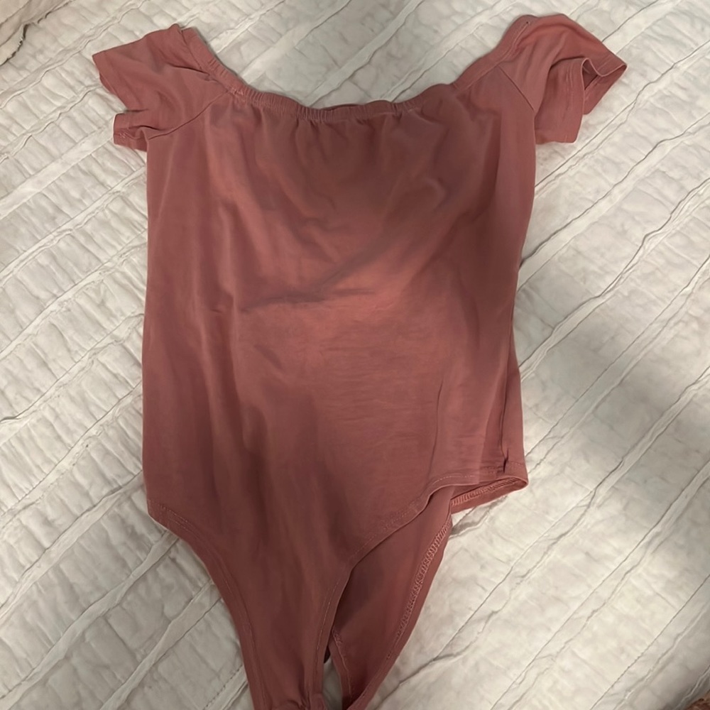 Pink body suit with criss cross back